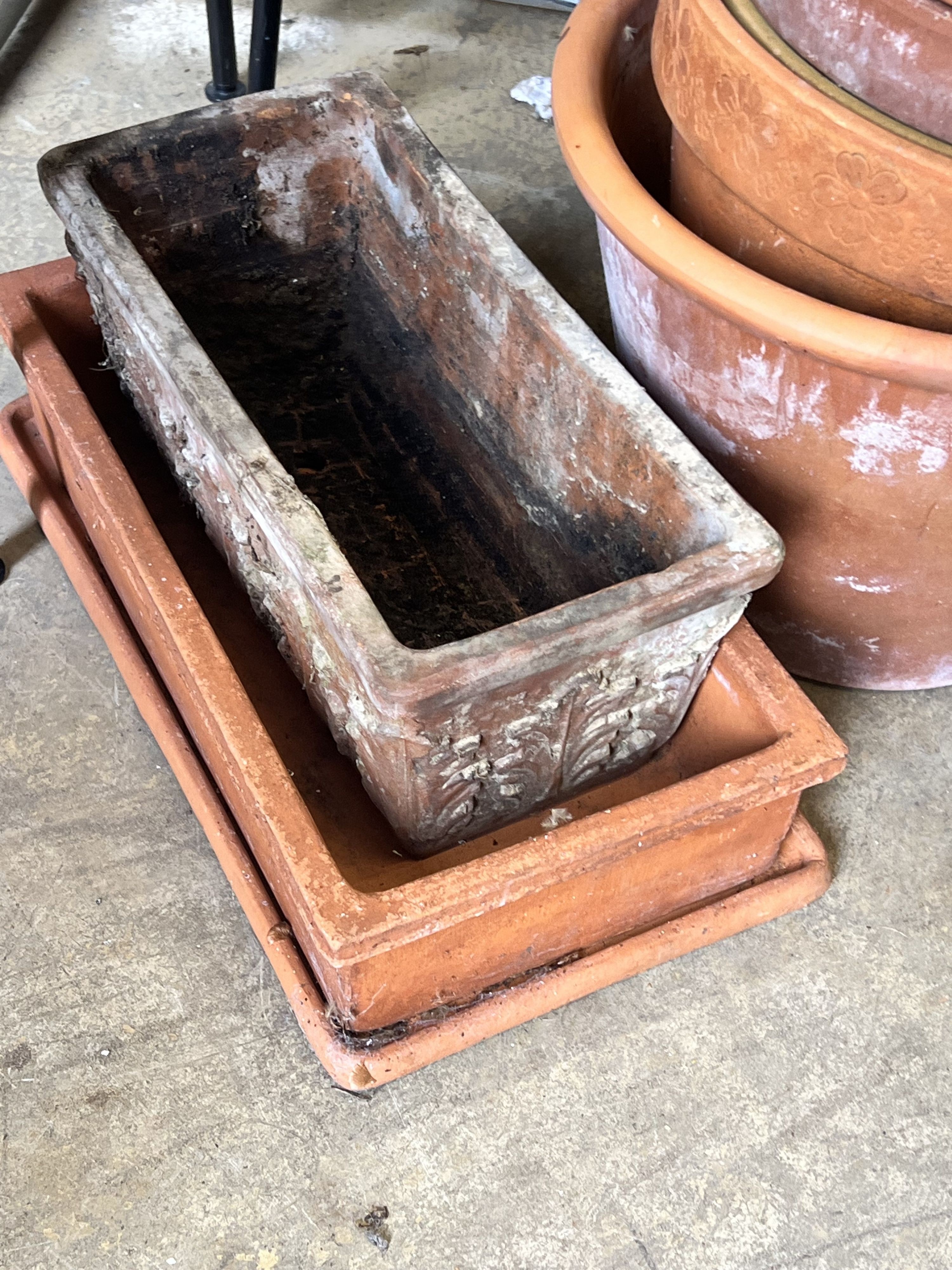 Approximately fifty assorted terracotta garden pots